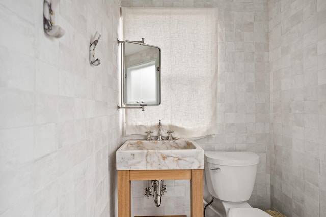 54 Roberts Way, Santa Rosa Beach, FL 32459 - bathroom featuring toilet and tile walls