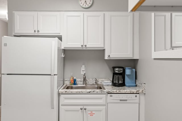 134 Damon Cir Unit Q, Panama City Beach, FL 32407 - kitchen with white appliances, white cabinetry, and light countertops