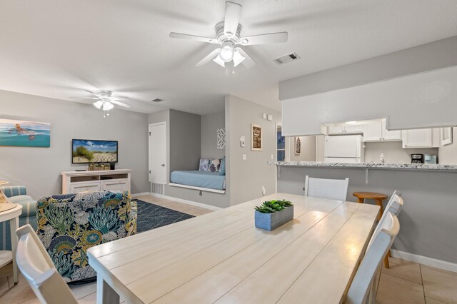 134 Damon Cir Unit Q, Panama City Beach, FL 32407 - dining space with ceiling fan and light tile patterned floors