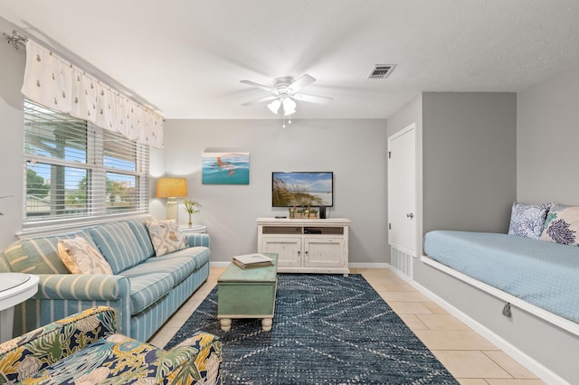 134 Damon Cir Unit Q, Panama City Beach, FL 32407 - living room featuring light tile patterned floors and a ceiling fan