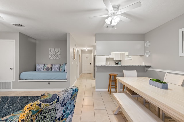 134 Damon Cir Unit Q, Panama City Beach, FL 32407 - dining area with light tile patterned floors and a ceiling fan