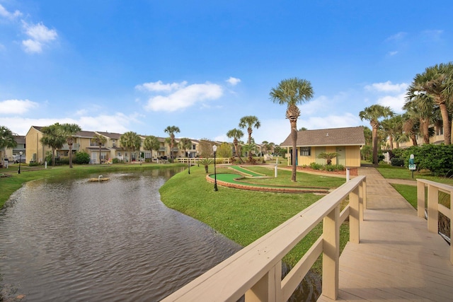 134 Damon Cir Unit Q, Panama City Beach, FL 32407 - view of community with a residential view, a water view, a lawn, and a putting area