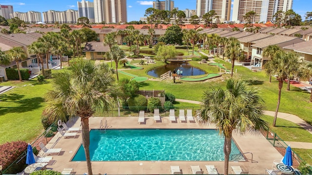 134 Damon Cir Unit Q, Panama City Beach, FL 32407 - community pool with a yard and a city view