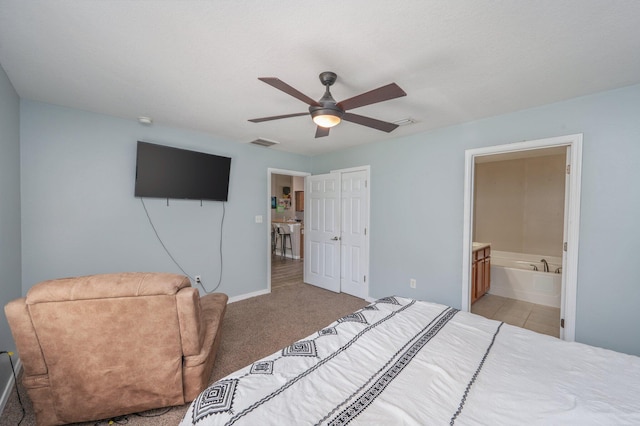 80 Azalea Trce, Defuniak Springs, FL 32433 - bedroom with ensuite bath, a ceiling fan, and light carpet