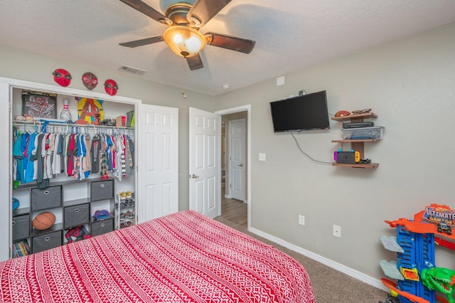 80 Azalea Trce, Defuniak Springs, FL 32433 - carpeted bedroom featuring a textured ceiling, a closet, and a ceiling fan