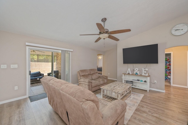 80 Azalea Trce, Defuniak Springs, FL 32433 - living room with arched walkways, vaulted ceiling, light wood finished floors, and a ceiling fan
