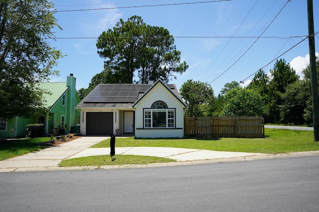 1198 Saddle Creek Dr, Fort Walton Beach, FL 32547 - view of front of home with concrete driveway, roof mounted solar panels, and a garage