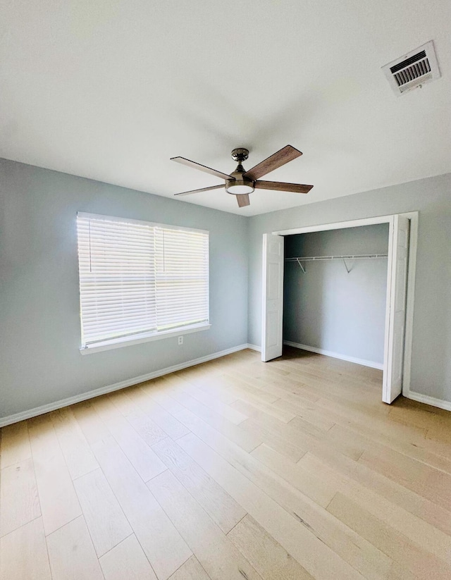 1198 Saddle Creek Dr, Fort Walton Beach, FL 32547 - unfurnished bedroom with a ceiling fan, wood finished floors, and a closet