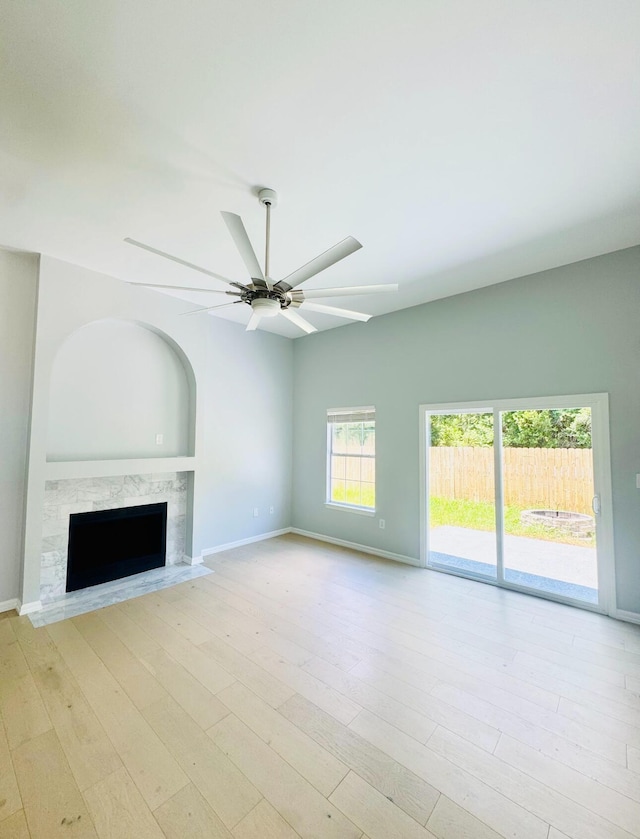 1198 Saddle Creek Dr, Fort Walton Beach, FL 32547 - unfurnished living room with a fireplace, wood finished floors, and a ceiling fan