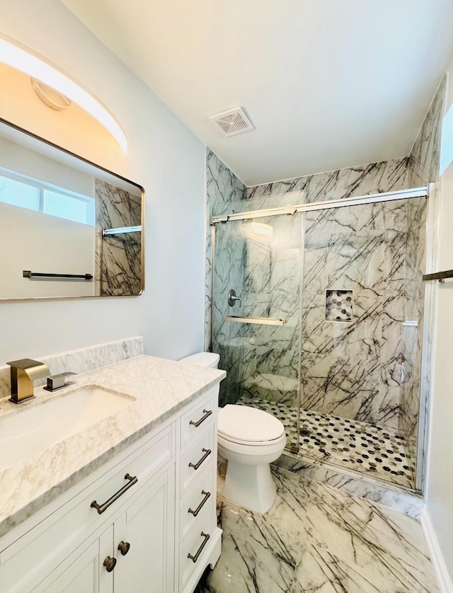 1198 Saddle Creek Dr, Fort Walton Beach, FL 32547 - bathroom featuring vanity, a marble finish shower, and marble look tile flooring