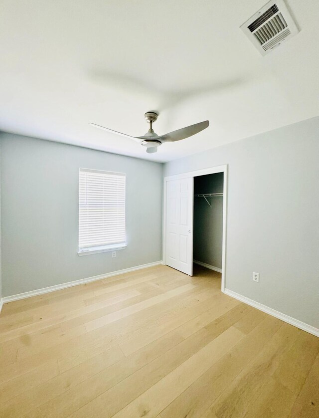 1198 Saddle Creek Dr, Fort Walton Beach, FL 32547 - unfurnished bedroom featuring a closet, light wood-type flooring, and ceiling fan
