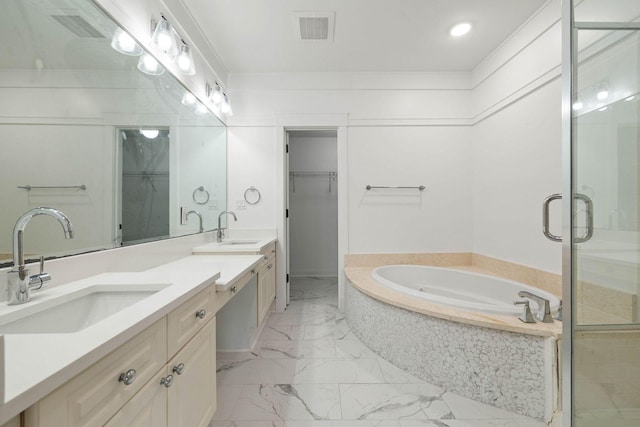 1101 Sawgrass Ct Unit 102, Panama City Beach, FL 32413 - full bath featuring marble look tile flooring, vanity, a bath, a shower stall, and a spacious closet