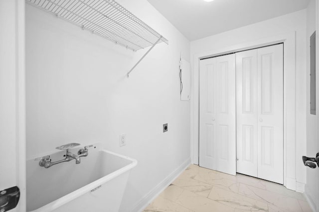 1101 Sawgrass Ct Unit 102, Panama City Beach, FL 32413 - laundry room with light marble finish floors and electric dryer hookup