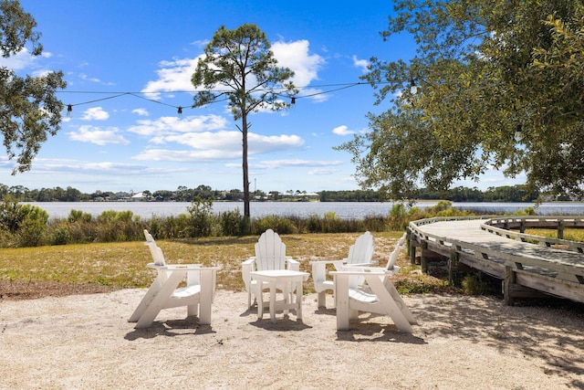 1101 Sawgrass Ct Unit 102, Panama City Beach, FL 32413 - view of yard with a water view and a fire pit