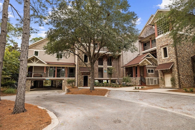 1101 Sawgrass Ct Unit 102, Panama City Beach, FL 32413 - view of property with driveway and a carport
