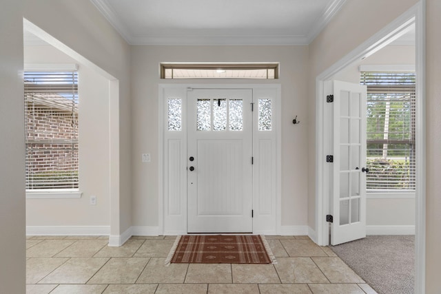 7478 Brevard St, Navarre, FL 32566 - foyer with light tile patterned flooring, healthy amount of natural light, and crown molding
