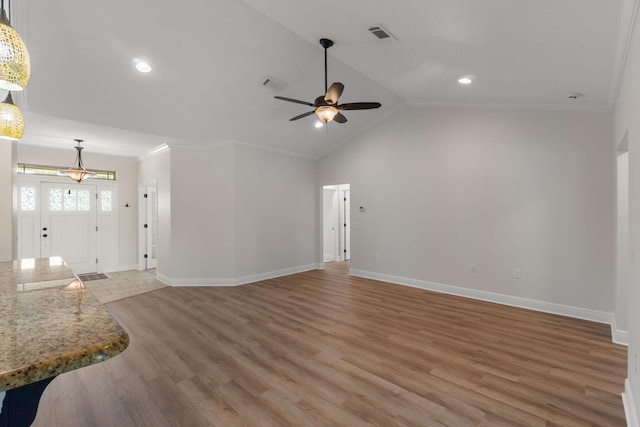 7478 Brevard St, Navarre, FL 32566 - unfurnished living room featuring ceiling fan, light wood finished floors, crown molding, recessed lighting, and lofted ceiling