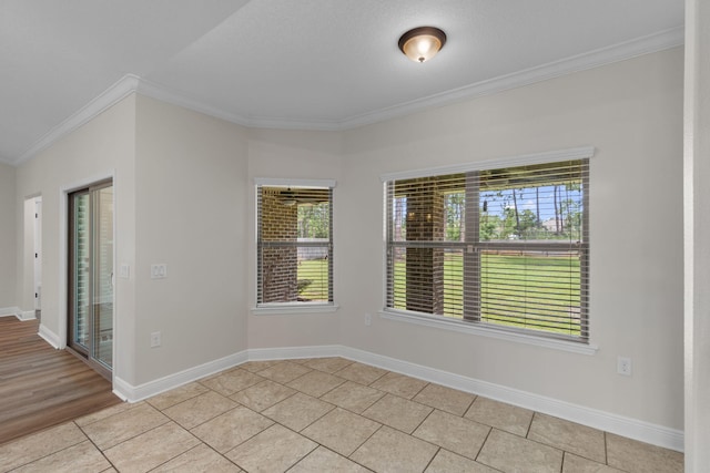 7478 Brevard St, Navarre, FL 32566 - empty room featuring ornamental molding and light tile patterned floors