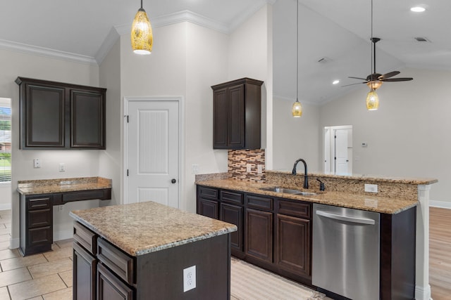 7478 Brevard St, Navarre, FL 32566 - kitchen with stainless steel dishwasher, dark brown cabinets, pendant lighting, a ceiling fan, and light stone countertops