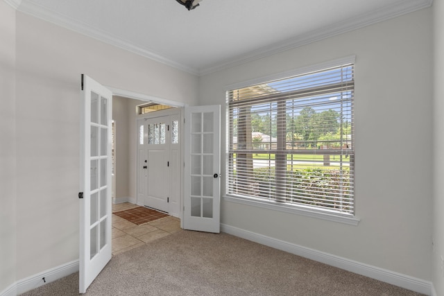 7478 Brevard St, Navarre, FL 32566 - entryway with french doors, crown molding, and carpet