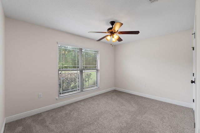7478 Brevard St, Navarre, FL 32566 - carpeted spare room featuring ceiling fan and baseboards