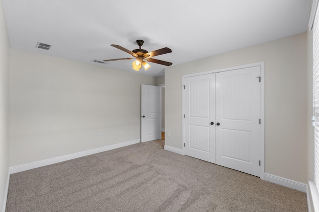 7478 Brevard St, Navarre, FL 32566 - unfurnished bedroom with carpet, a closet, and a ceiling fan