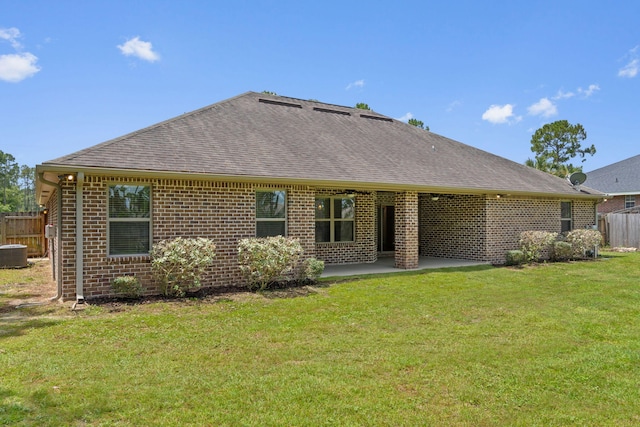 7478 Brevard St, Navarre, FL 32566 - back of property featuring brick siding, roof with shingles, and a patio
