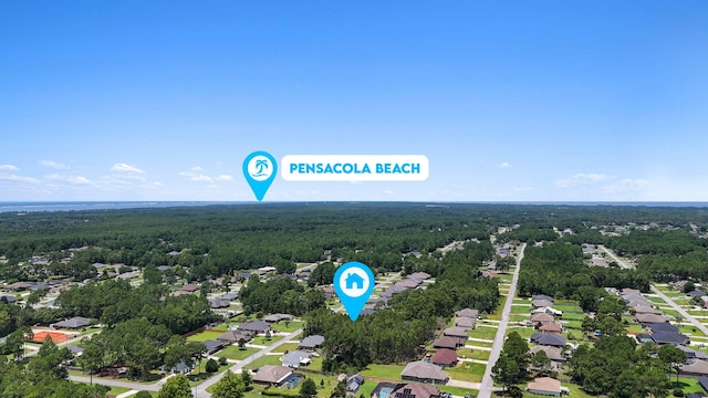 7478 Brevard St, Navarre, FL 32566 - aerial view of residential area featuring a heavily wooded area