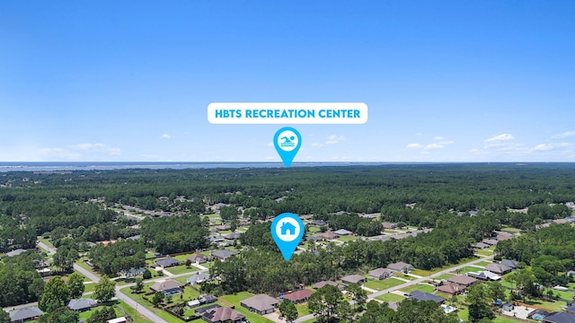 7478 Brevard St, Navarre, FL 32566 - aerial view of residential area with a heavily wooded area
