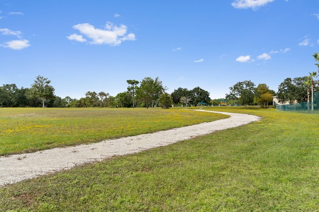 7478 Brevard St, Navarre, FL 32566 - view of property's community with driveway and a yard