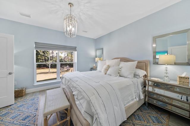115 N Barcelona Ave, Santa Rosa Beach, FL 32459 - bedroom with a chandelier and baseboards