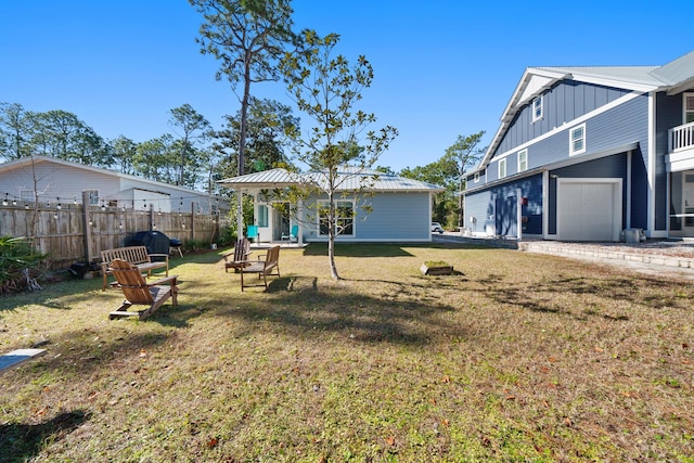 115 N Barcelona Ave, Santa Rosa Beach, FL 32459 - rear view of property with board and batten siding and an attached garage