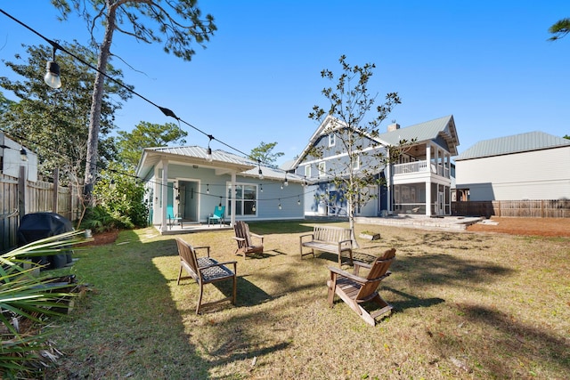 115 N Barcelona Ave, Santa Rosa Beach, FL 32459 - rear view of property featuring a balcony and a metal roof