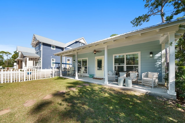 115 N Barcelona Ave, Santa Rosa Beach, FL 32459 - back of property with a patio area, an outdoor living space, a metal roof, and ceiling fan