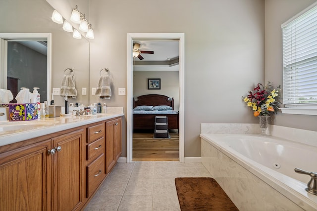 4820 Griffith Rd, Holt, FL 32564 - full bath featuring ceiling fan, double vanity, ensuite bath, a jetted tub, and tile patterned flooring