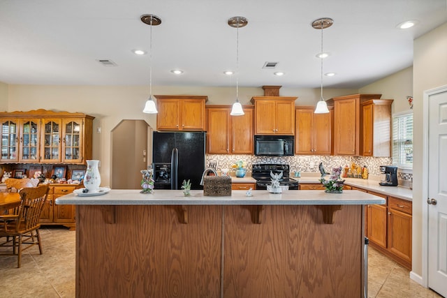 4820 Griffith Rd, Holt, FL 32564 - kitchen with black appliances, tasteful backsplash, light tile patterned floors, and recessed lighting
