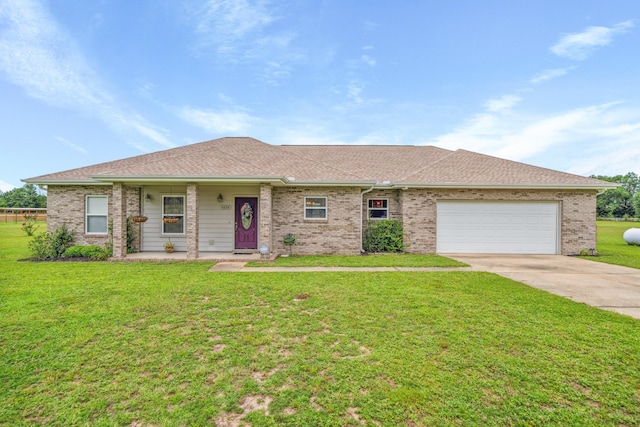 4820 Griffith Rd, Holt, FL 32564 - ranch-style home featuring concrete driveway, an attached garage, a front yard, and brick siding