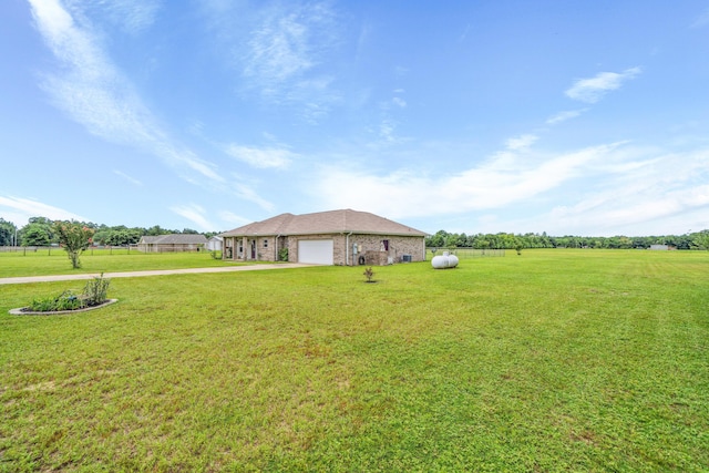 4820 Griffith Rd, Holt, FL 32564 - view of green lawn featuring a garage and concrete driveway