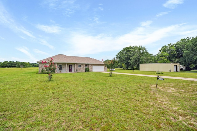 4820 Griffith Rd, Holt, FL 32564 - view of front of house featuring concrete driveway, a garage, and a front lawn
