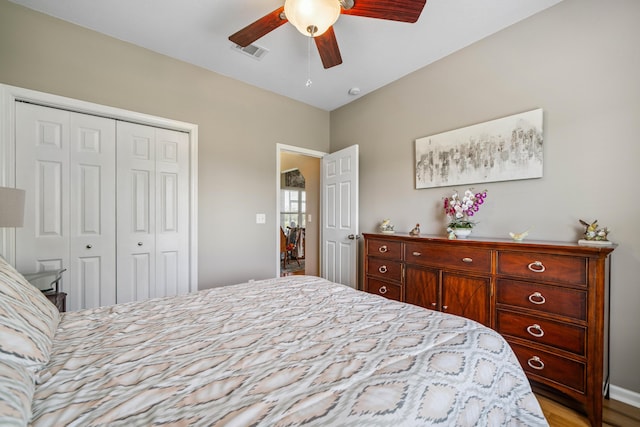 4820 Griffith Rd, Holt, FL 32564 - bedroom with a closet, ceiling fan, and light wood finished floors