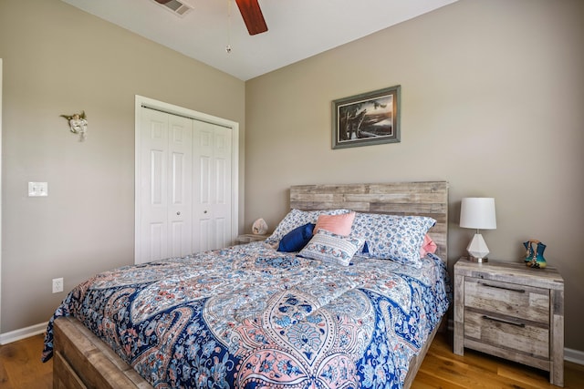 4820 Griffith Rd, Holt, FL 32564 - bedroom with wood finished floors, a closet, and ceiling fan