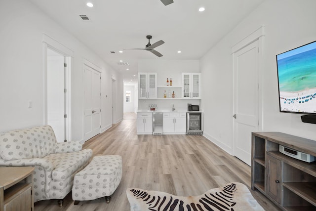 1831 Tuscana Pl, Miramar Beach, FL 32550 - living room featuring wine cooler, bar, recessed lighting, light wood-type flooring, and a ceiling fan