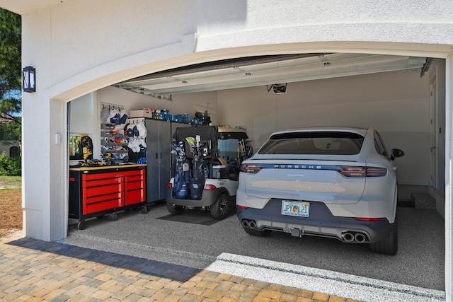 1831 Tuscana Pl, Miramar Beach, FL 32550 - garage featuring a garage door opener and driveway