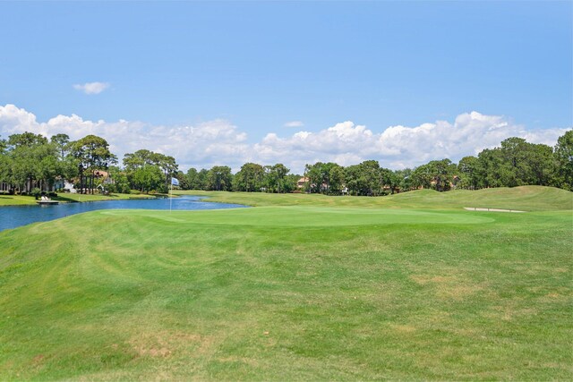 1831 Tuscana Pl, Miramar Beach, FL 32550 - view of community with view of golf course, a water view, view of wooded area, and a lawn