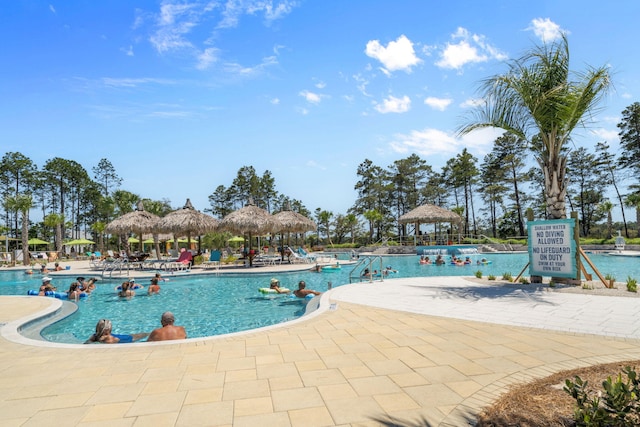 8546 Dreams Float Ct, Panama City Beach, FL 32413 - community pool with a gazebo and a patio area