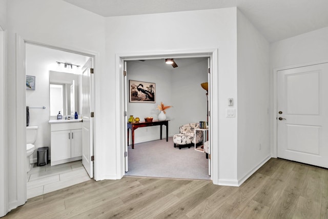 8546 Dreams Float Ct, Panama City Beach, FL 32413 - corridor with light wood finished floors and baseboards