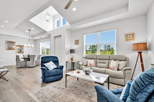 8546 Dreams Float Ct, Panama City Beach, FL 32413 - living area with a chandelier, light wood-style flooring, recessed lighting, and a ceiling fan
