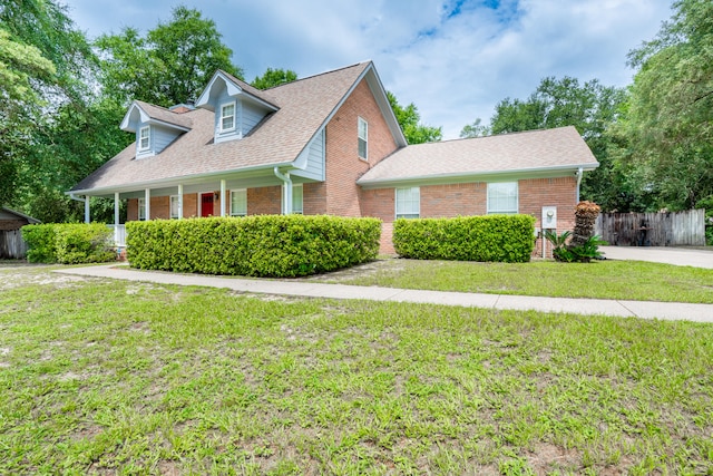 2786 Willow Bend Ct, Crestview, FL 32539 - new england style home featuring brick siding, roof with shingles, and covered porch
