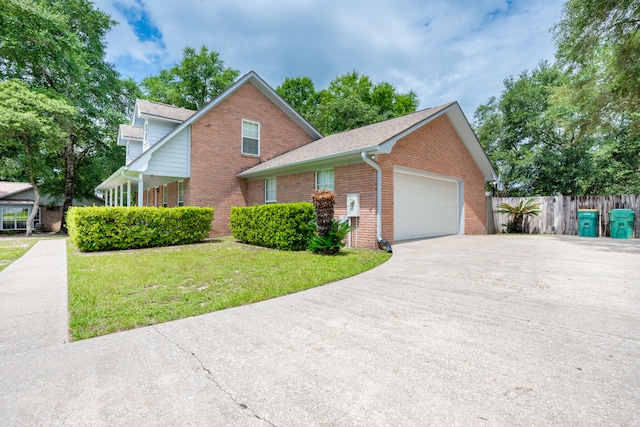 2786 Willow Bend Ct, Crestview, FL 32539 - traditional-style home with brick siding, a garage, concrete driveway, and a shingled roof