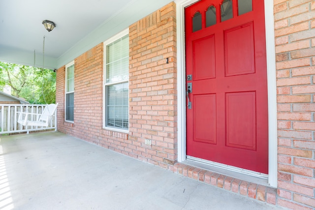 2786 Willow Bend Ct, Crestview, FL 32539 - view of exterior entry featuring covered porch and brick siding